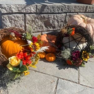 Autumn wreaths with pumpkins and flowers.