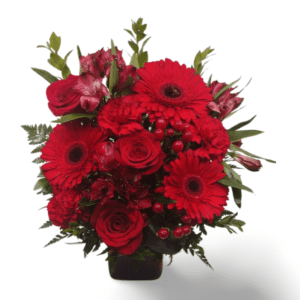 Red rose and gerbera bouquet in vase.