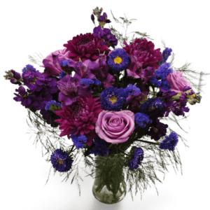 Purple and lavender flower arrangement in vase.